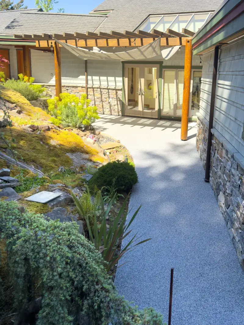 Resin-bound walkway leading into a covered patio