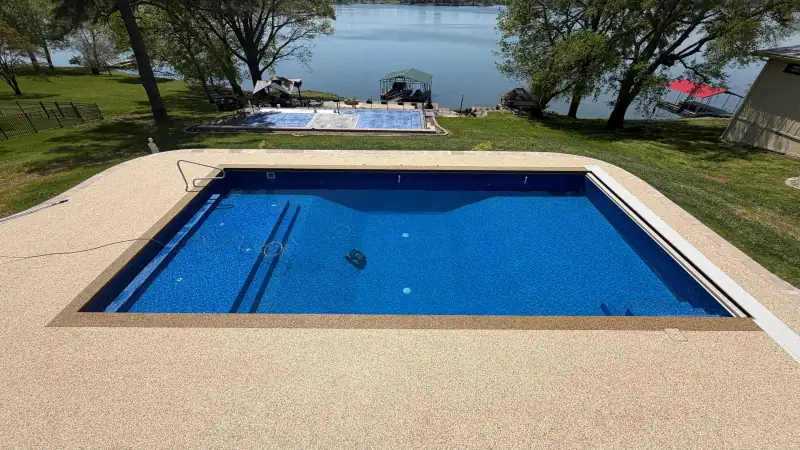 Rio Medina blend pool deck around a rectangular pool by a lake