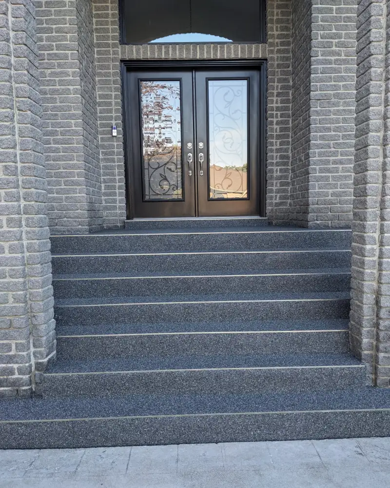 Dark grey Manhattan blend front steps leading to double doors