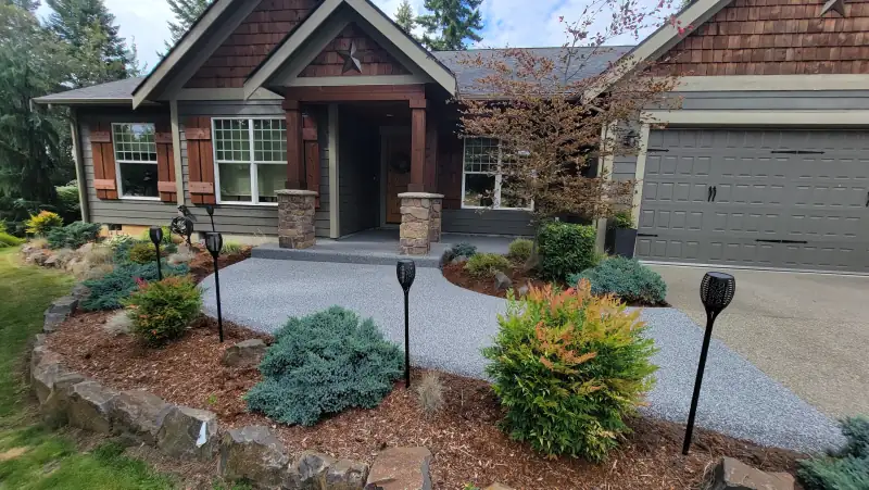 Palazzo blend front walkway lined with garden lights at a craftsman home