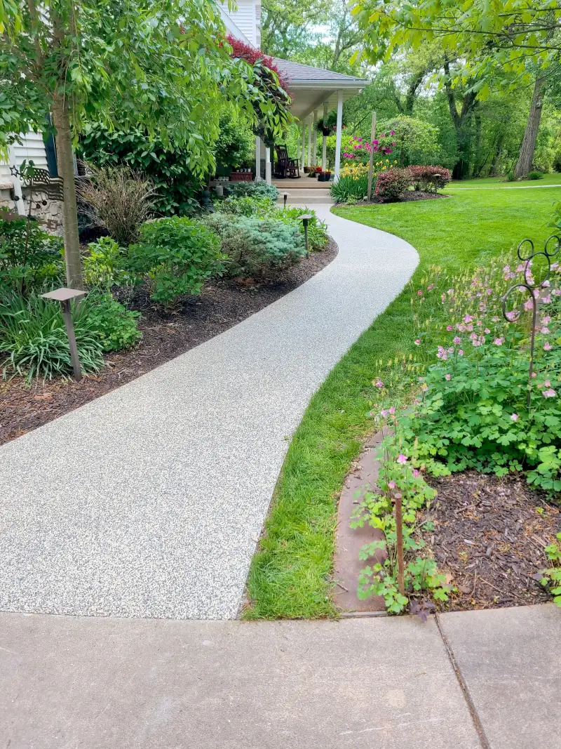 Curving The Burj blend path through a lawn and flower beds